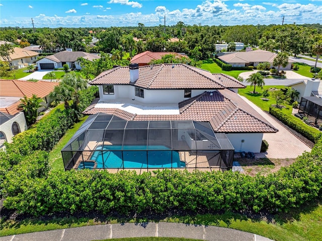 1484 Seafarer Dr, Osprey, FL 34229 - outdoor pool with glass enclosure, a residential view, and a patio area