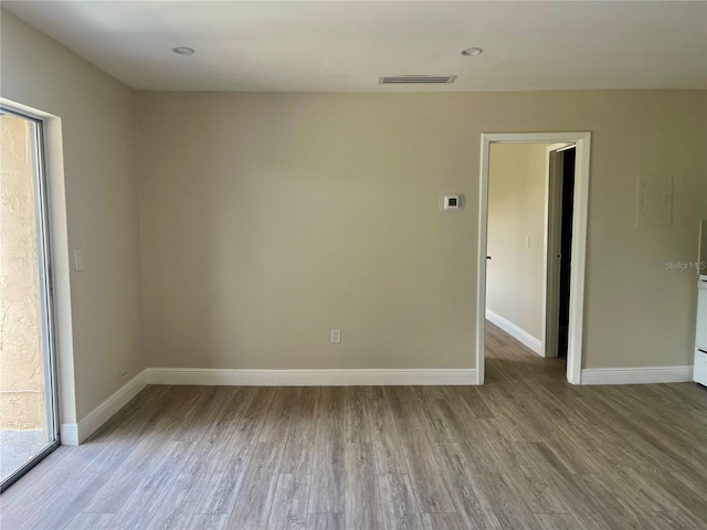 2636 Hidden Lake Dr N Unit G, Sarasota, FL 34237 - empty room featuring wood finished floors and baseboards