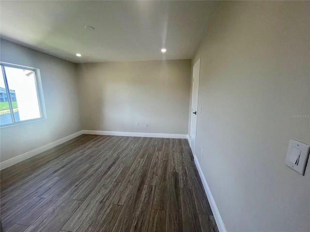 2636 Hidden Lake Dr N Unit G, Sarasota, FL 34237 - unfurnished room with dark wood finished floors and recessed lighting
