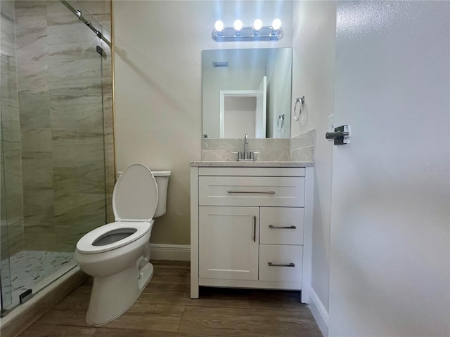 2636 Hidden Lake Dr N Unit G, Sarasota, FL 34237 - full bath featuring a shower stall, vanity, and wood finished floors