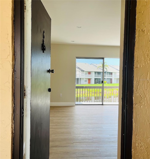 2636 Hidden Lake Dr N Unit G, Sarasota, FL 34237 - corridor featuring wood finished floors and baseboards