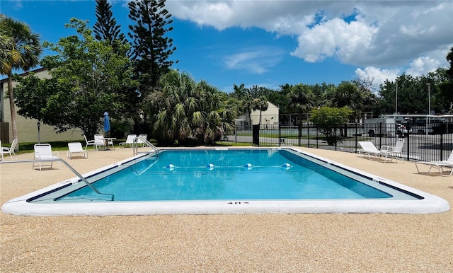 2636 Hidden Lake Dr N Unit G, Sarasota, FL 34237 - community pool with a patio area and view of scattered trees