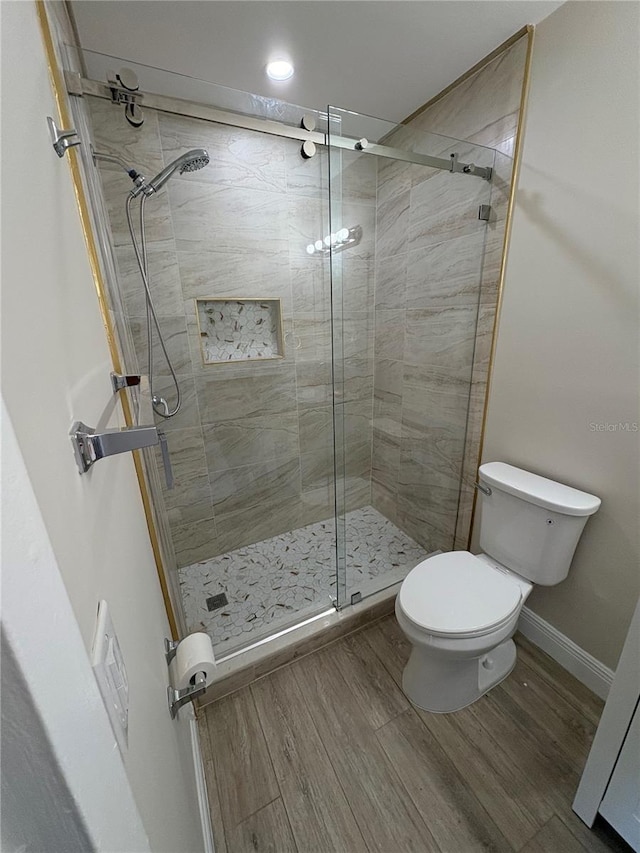 2636 Hidden Lake Dr N Unit G, Sarasota, FL 34237 - bathroom featuring wood finished floors and a shower stall
