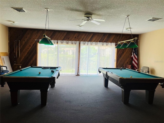2636 Hidden Lake Dr N Unit G, Sarasota, FL 34237 - game room featuring pool table, healthy amount of natural light, a ceiling fan, carpet, and wood walls