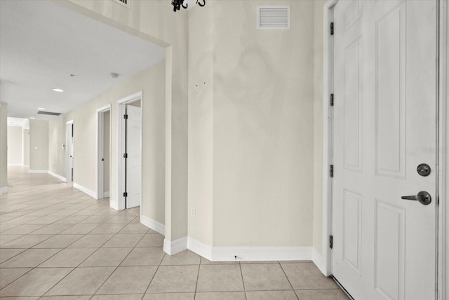 5100 Jessie Harbor Dr Unit 701, Osprey, FL 34229 - corridor featuring light tile patterned flooring and recessed lighting