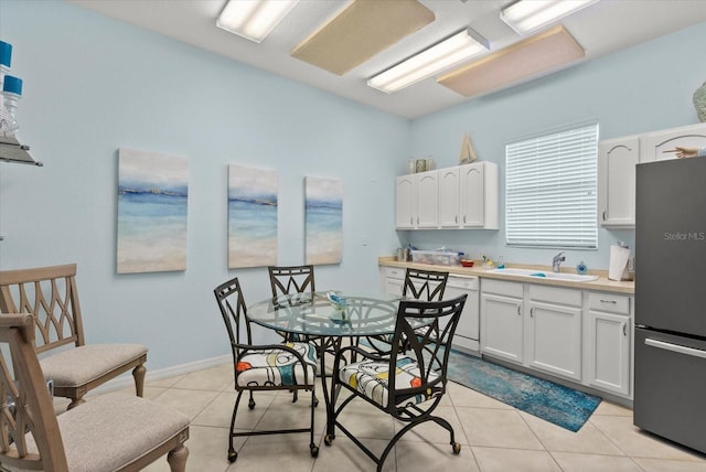 5100 Jessie Harbor Dr Unit 701, Osprey, FL 34229 - dining room featuring light tile patterned flooring and baseboards