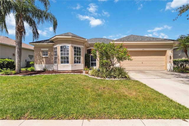 315 36th St NE, Bradenton, FL 34208 - ranch-style house featuring stucco siding, a garage, driveway, and a front yard