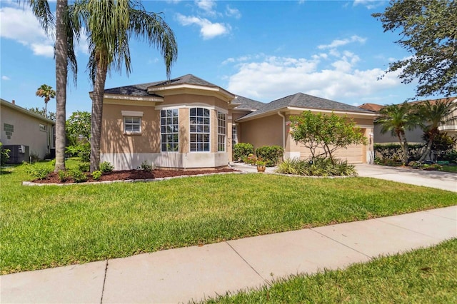 315 36th St NE, Bradenton, FL 34208 - view of front of property with stucco siding, concrete driveway, a garage, and a front yard