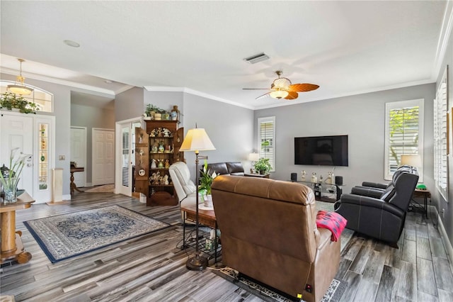 315 36th St NE, Bradenton, FL 34208 - living area with wood finished floors, healthy amount of natural light, a ceiling fan, and ornamental molding