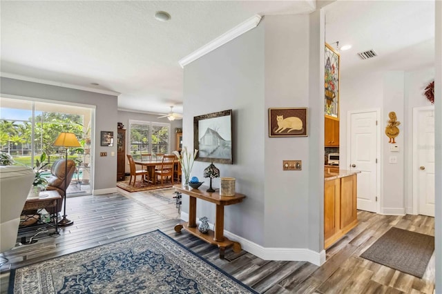 315 36th St NE, Bradenton, FL 34208 - hall featuring crown molding and light wood finished floors