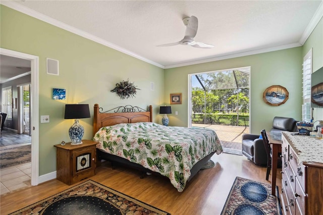 315 36th St NE, Bradenton, FL 34208 - bedroom with wood finished floors, access to exterior, multiple windows, crown molding, and a ceiling fan