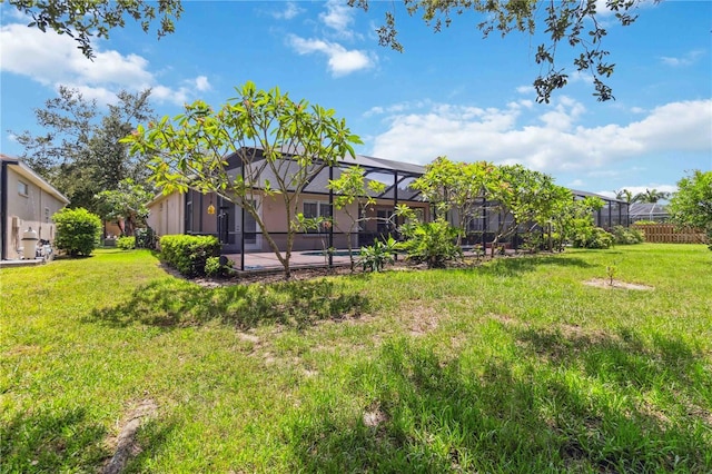 315 36th St NE, Bradenton, FL 34208 - view of green lawn featuring a lanai, a patio, and a pool