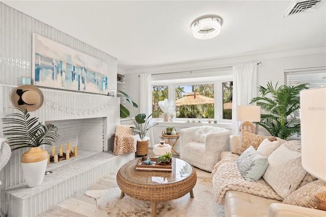 1112 Montezuma Dr, Bradenton, FL 34209 - living room with wood finished floors and a fireplace with raised hearth
