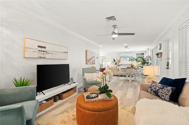 1112 Montezuma Dr, Bradenton, FL 34209 - living area with crown molding, wood finished floors, and ceiling fan