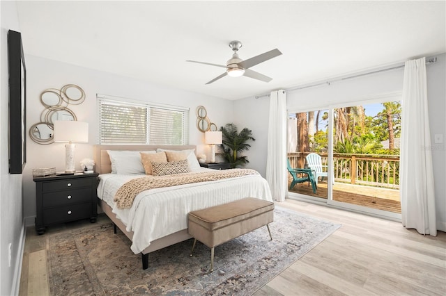 1112 Montezuma Dr, Bradenton, FL 34209 - bedroom featuring access to exterior, multiple windows, and wood finished floors