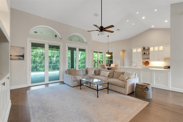 8102 Waterview Blvd, Lakewood Ranch, FL 34202 - living room with ceiling fan, high vaulted ceiling, dark wood-style floors, arched walkways, and recessed lighting
