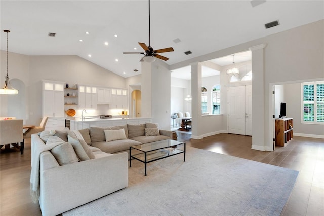 8102 Waterview Blvd, Lakewood Ranch, FL 34202 - living area featuring high vaulted ceiling, wood finished floors, recessed lighting, ceiling fan, and a chandelier