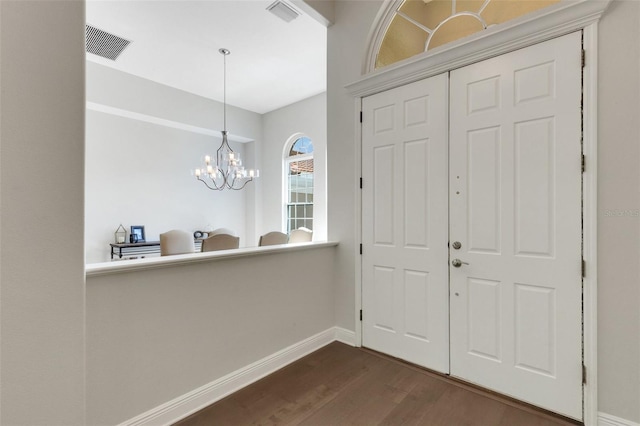 8102 Waterview Blvd, Lakewood Ranch, FL 34202 - foyer entrance featuring dark wood-style floors and a chandelier