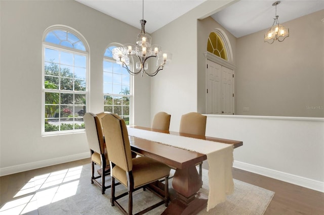 8102 Waterview Blvd, Lakewood Ranch, FL 34202 - dining area featuring a chandelier and wood finished floors