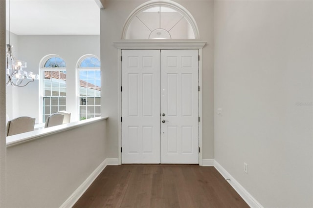 8102 Waterview Blvd, Lakewood Ranch, FL 34202 - entrance foyer with dark wood-style flooring and a chandelier