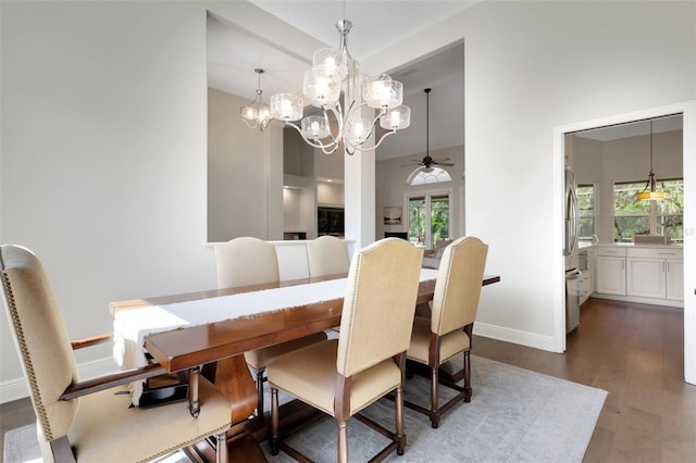 8102 Waterview Blvd, Lakewood Ranch, FL 34202 - dining room with a ceiling fan, dark wood-style flooring, and a chandelier