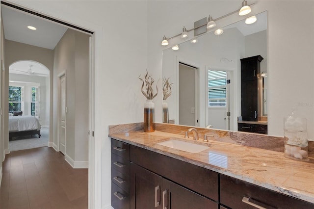 8102 Waterview Blvd, Lakewood Ranch, FL 34202 - bathroom with vanity, connected bathroom, and wood finished floors