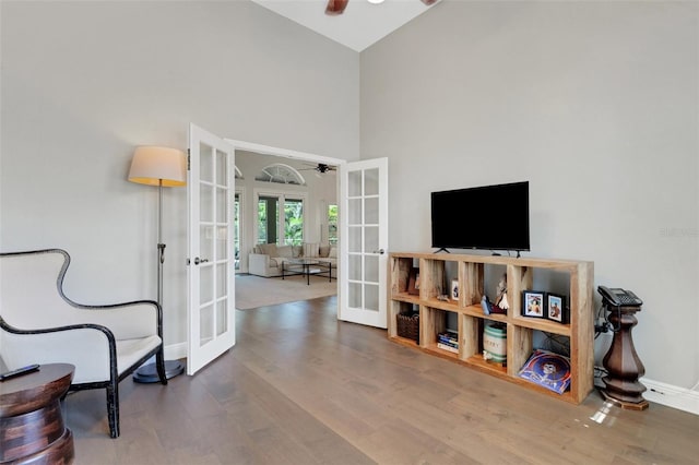 8102 Waterview Blvd, Lakewood Ranch, FL 34202 - living area featuring french doors, ceiling fan, high vaulted ceiling, and wood finished floors