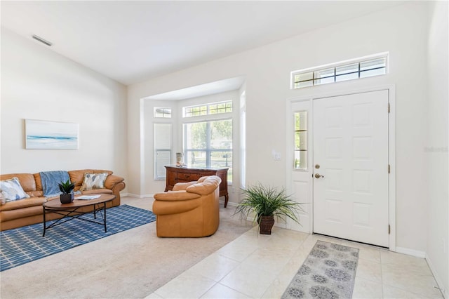 4845 Post Pointe Dr, Sarasota, FL 34233 - entrance foyer with light tile patterned flooring and baseboards