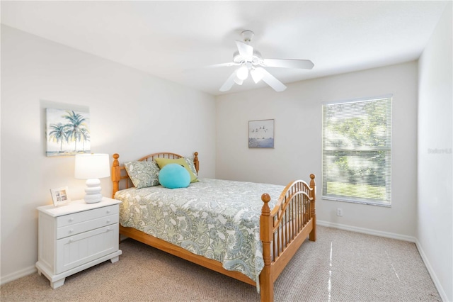4845 Post Pointe Dr, Sarasota, FL 34233 - bedroom with multiple windows, light carpet, and ceiling fan