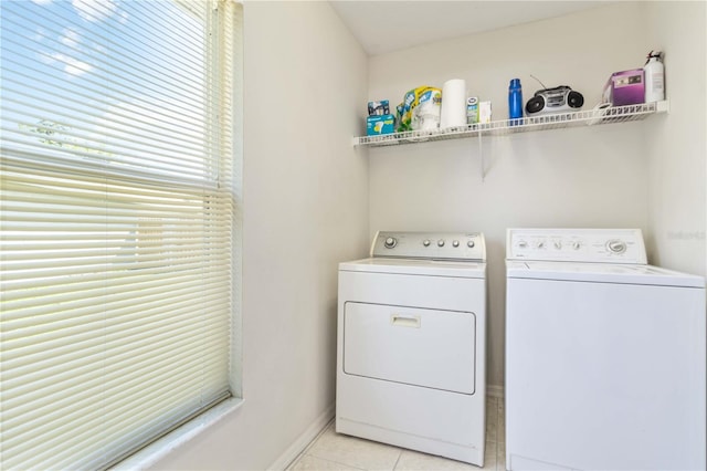 4845 Post Pointe Dr, Sarasota, FL 34233 - laundry room with washing machine and dryer and light tile patterned floors