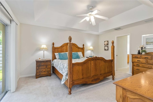 4845 Post Pointe Dr, Sarasota, FL 34233 - bedroom featuring light colored carpet, a raised ceiling, and ceiling fan