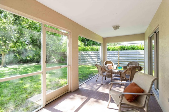 4845 Post Pointe Dr, Sarasota, FL 34233 - sunroom with wood finished floors