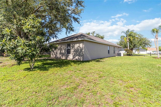 4845 Post Pointe Dr, Sarasota, FL 34233 - view of side of home featuring a yard