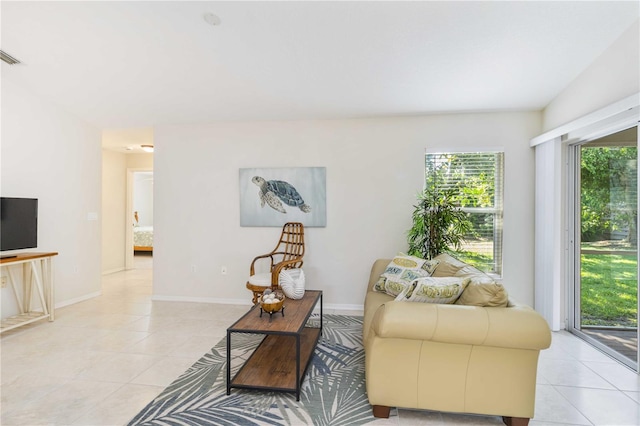 4845 Post Pointe Dr, Sarasota, FL 34233 - living room featuring light tile patterned floors