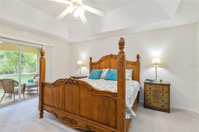 4845 Post Pointe Dr, Sarasota, FL 34233 - bedroom featuring light carpet, access to outside, a raised ceiling, and ceiling fan