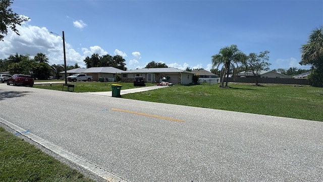 23067 Elmira Blvd, Punta Gorda, FL 33980 - view of asphalt street featuring street lights