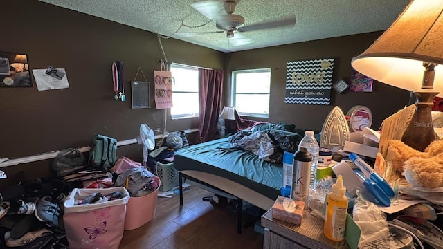 23067 Elmira Blvd, Punta Gorda, FL 33980 - bedroom with a textured ceiling, wood finished floors, and ceiling fan