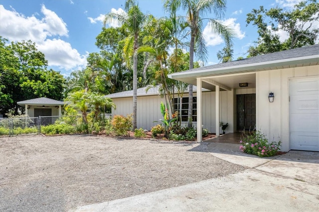 2866 E Rainbow Cir, Sarasota, FL 34231 - doorway to property with board and batten siding