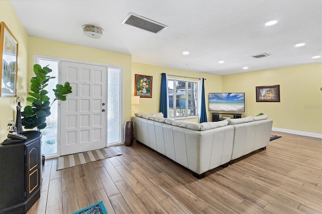 2866 E Rainbow Cir, Sarasota, FL 34231 - living area featuring light wood-style flooring and recessed lighting