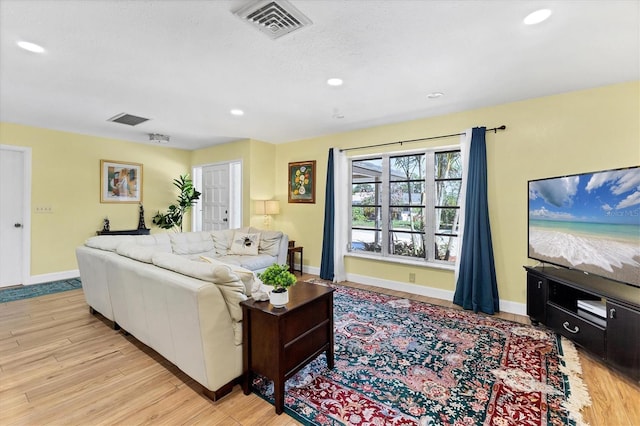 2866 E Rainbow Cir, Sarasota, FL 34231 - living room featuring light wood-style flooring and recessed lighting