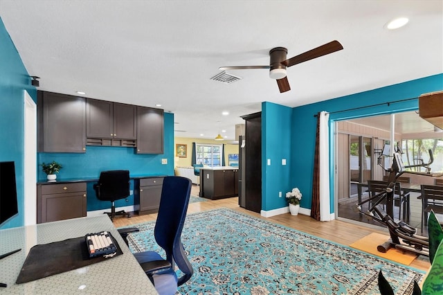 2866 E Rainbow Cir, Sarasota, FL 34231 - office space featuring a ceiling fan, light wood-style flooring, recessed lighting, and built in desk