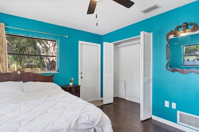 2866 E Rainbow Cir, Sarasota, FL 34231 - bedroom with wood finished floors, a closet, and a ceiling fan