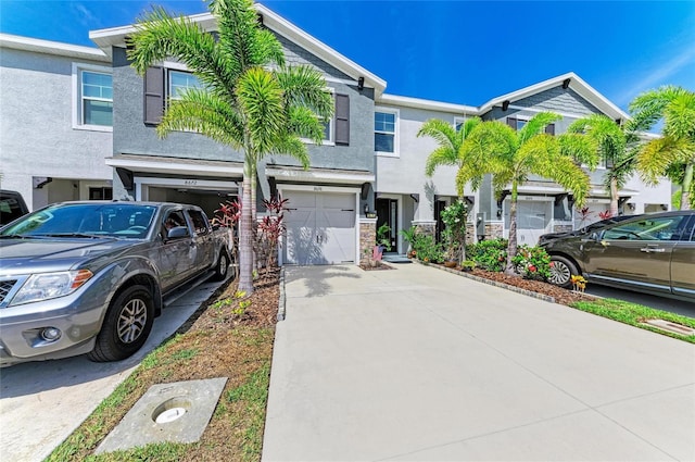 8676 Ice Wine St, Sarasota, FL 34238 - multi unit property with a garage, driveway, and stucco siding