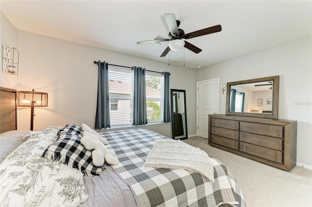 8676 Ice Wine St, Sarasota, FL 34238 - bedroom with light carpet and a ceiling fan