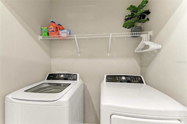 8676 Ice Wine St, Sarasota, FL 34238 - laundry room featuring washer and clothes dryer