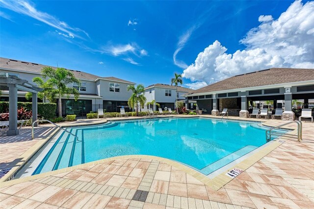 8676 Ice Wine St, Sarasota, FL 34238 - community pool with a patio and a residential view