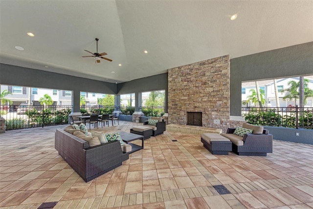 8676 Ice Wine St, Sarasota, FL 34238 - view of patio / terrace with an outdoor living space with a fireplace and ceiling fan