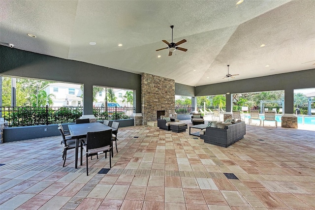 8676 Ice Wine St, Sarasota, FL 34238 - view of patio featuring an outdoor living space with a fireplace, an outdoor pool, ceiling fan, and outdoor dining area