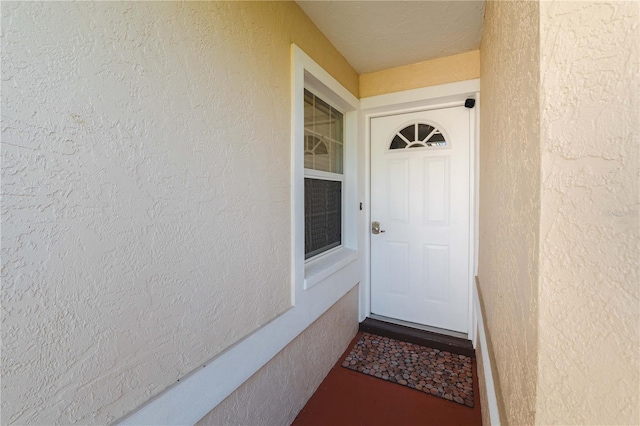 2511 Lantana Ln, Palmetto, FL 34221 - doorway to property featuring stucco siding