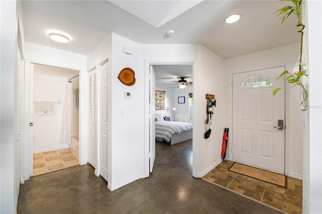 2511 Lantana Ln, Palmetto, FL 34221 - entryway with baseboards and a textured ceiling